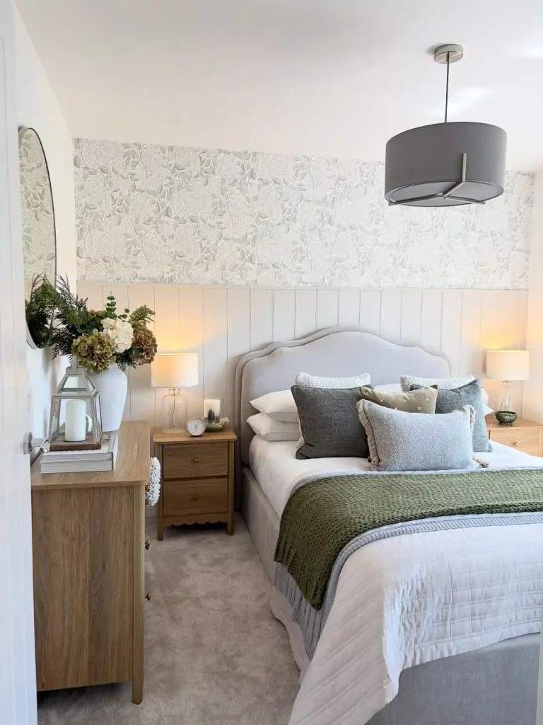 19. Wallpaper Panel Guest Bedroom with Vertical Shiplap and a Green Knit Throw